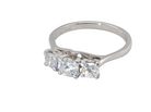 top view An exceptional three stone diamond trilogy ring, beautifully crafted in platinum and set with three modern brilliant cut white diamonds.