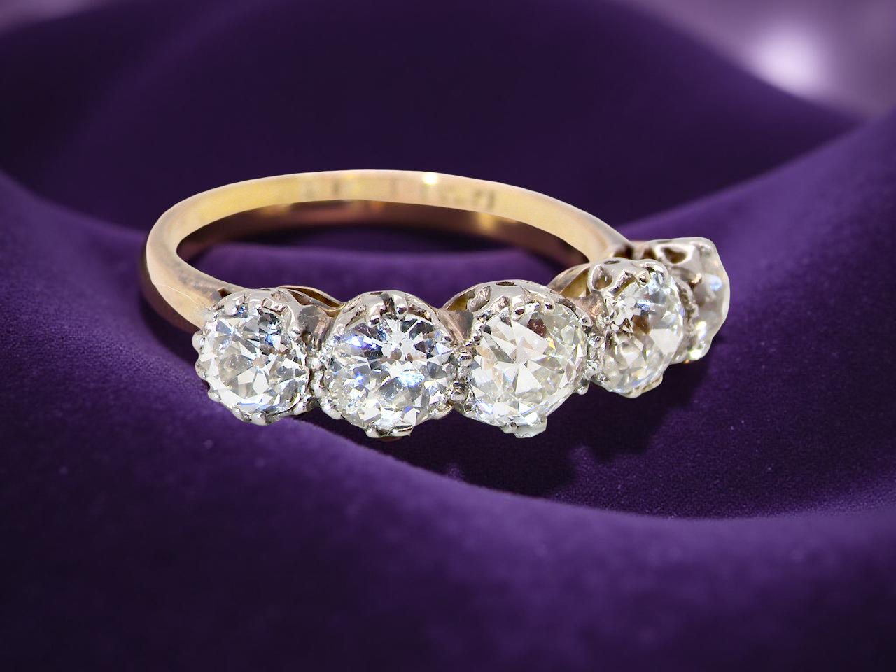 top view An impressive early 20th-century ring set with five old brilliant-cut white diamonds.