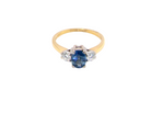 top view The iconic trilogy ring, featuring an oval cut sapphire centre stone, with a pleasing mid blue hue set into four claws, 7x5mm (0.75 carats est)