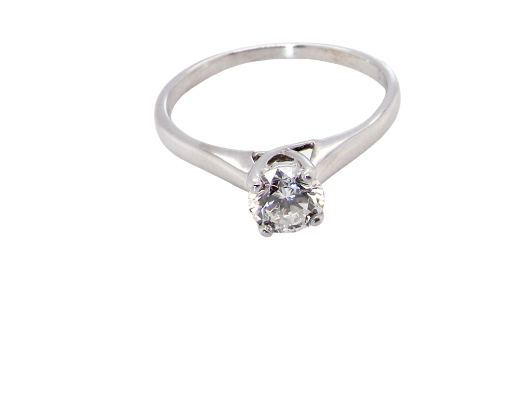 top view  solitaire ring containing a fine modern brilliant cut white diamond. Measures 5.4mm (.53 carats)

Colour G-h, clarity Si. Modern feature under setting, depth 6.8mm, weight 2.6grams.
 