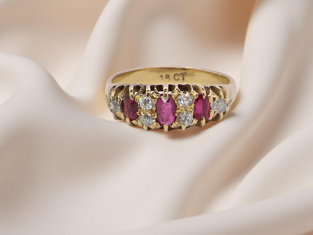 typical boat shaped ring from the late Victorian era, probably 1890-1900. This ring with three oval cut rubies,