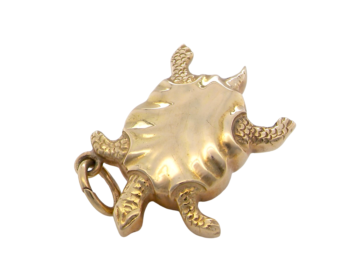 Gold turtle-shaped object on a white background