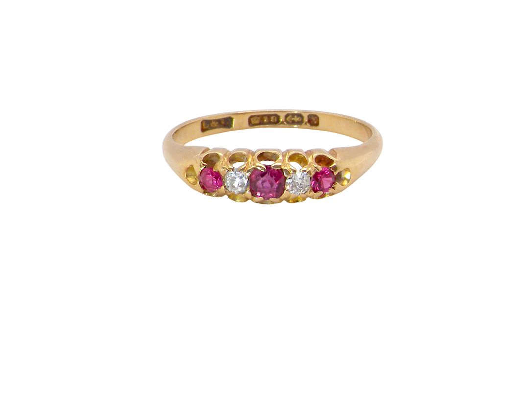 A vintage 18 carat gold three stone ring. Set with brilliant cut white diamonds, cente 3mm, each side a 2.4mm diamond (total est 0.20 carats) Colour I-j, clarity Si.&nbsp;
