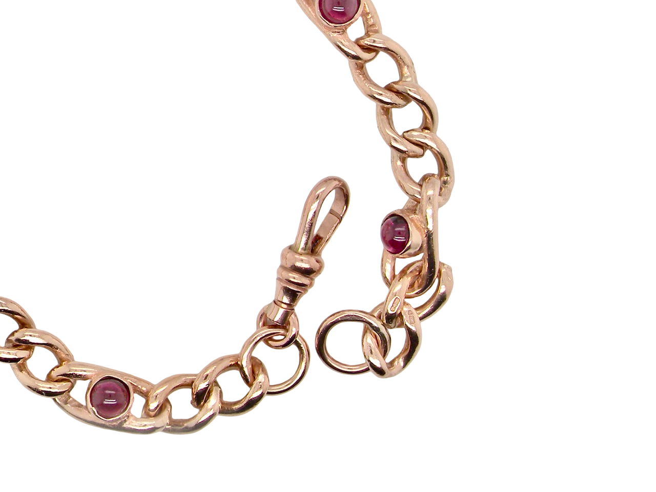 A vintage curb bracelet set with garnets