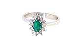 white gold cluster ring.

Centre stone is an oval cut emerald, 6x3.7mm (just under 0.50 carats) deep green hue.