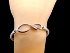 wrist A sterling silver bangle by the Welsh jewellers- Clogau.&nbsp;