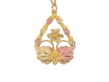 pink and yellow gold floral pendant