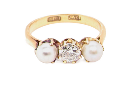 An antique pearl and diamond three stone ring