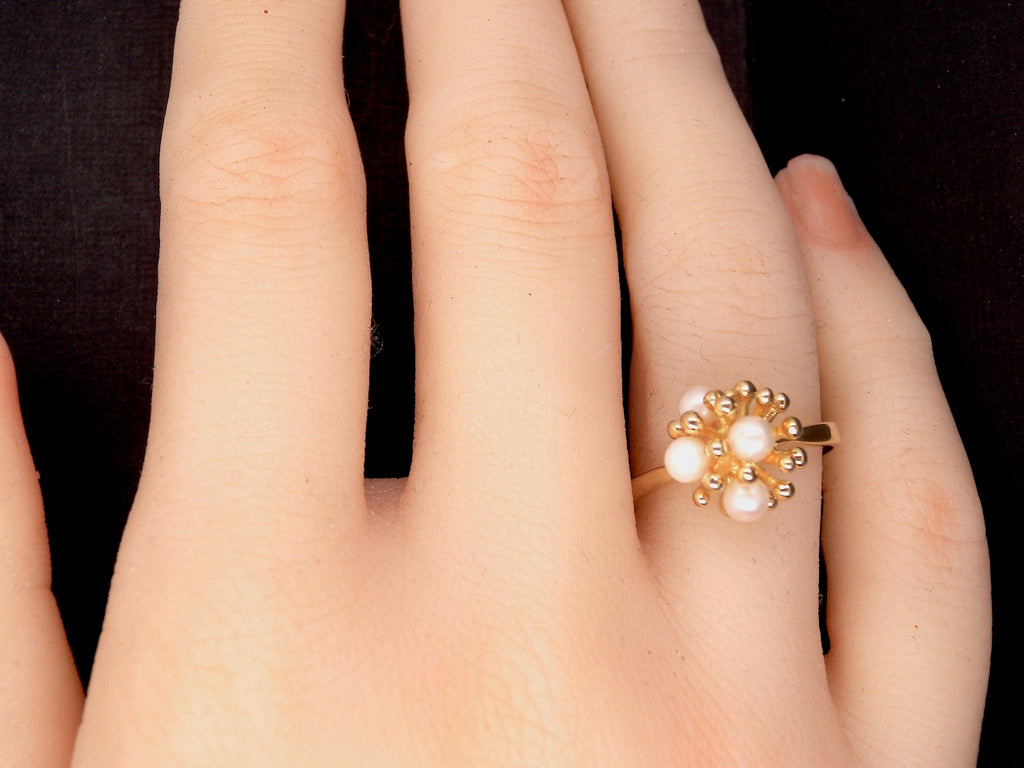 A modern cultured pearl gold dress ring
