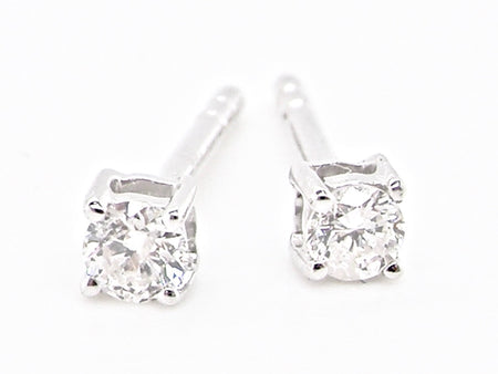A pair of tiny 0.10 carat white gold diamond earrings