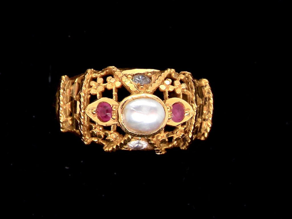 A high carat gold ruby and pearl  ring