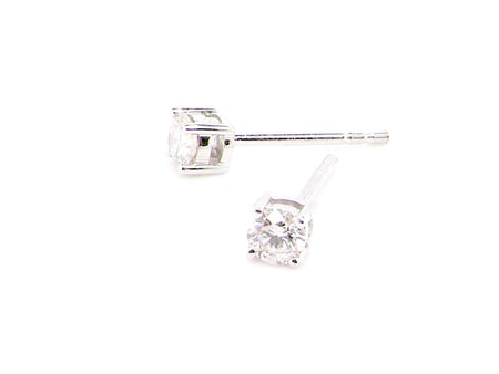 A pair of quarter carat diamond stud earrings