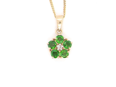 A green diopside and diamond pendant