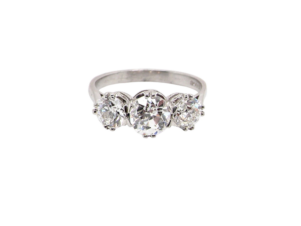 Vintage three stone platinum diamond ring